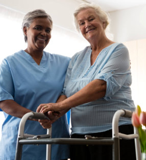 Nurse with elderly woman walker
