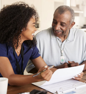 Nurse reviewing documents with patient